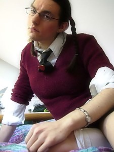 Crossdresser dressed as a slutty schoolgirl